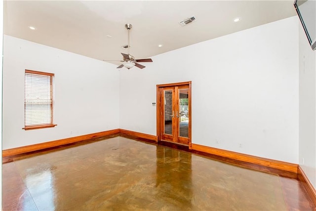 500 W Willow St, Ponchatoula, LA 70454 - unfurnished room featuring a healthy amount of sunlight, ceiling fan, and concrete floors