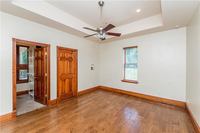500 W Willow St, Ponchatoula, LA 70454 - spare room featuring ceiling fan, light hardwood / wood-style floors, and a raised ceiling