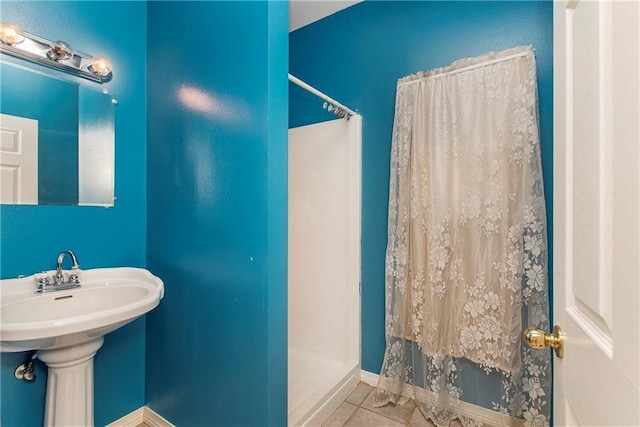 500 W Willow St, Ponchatoula, LA 70454 - bathroom featuring tile patterned floors, a shower with curtain, and sink