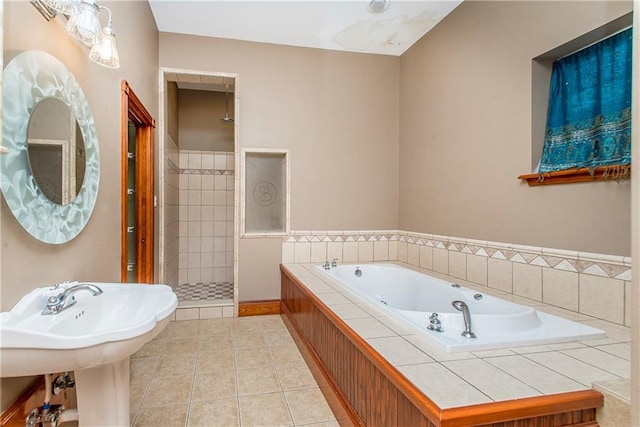 500 W Willow St, Ponchatoula, LA 70454 - bathroom featuring tile patterned flooring and shower with separate bathtub