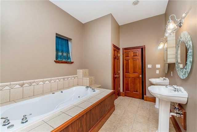 500 W Willow St, Ponchatoula, LA 70454 - bathroom with tiled bath and tile patterned floors