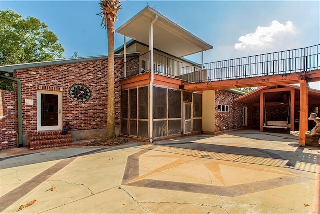 500 W Willow St, Ponchatoula, LA 70454 - rear view of property with a patio and a sunroom