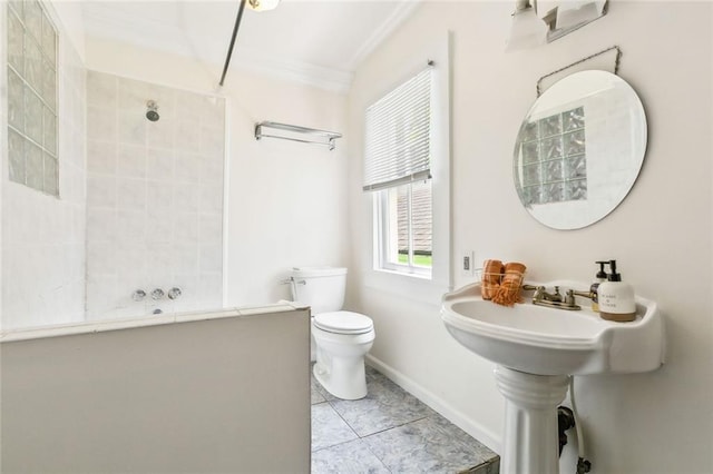 bathroom with ornamental molding, toilet, and tile patterned floors