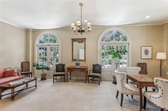 sitting room with light carpet, an inviting chandelier, and crown molding