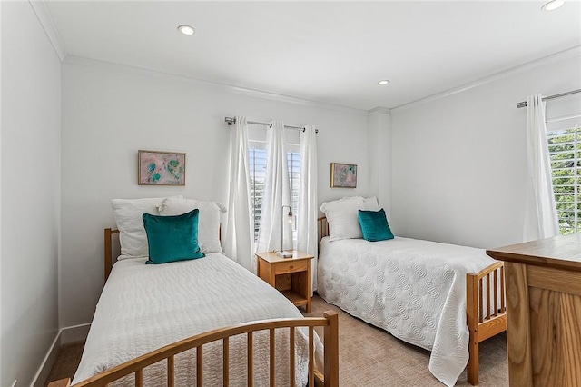 bedroom featuring light carpet, recessed lighting, baseboards, and ornamental molding