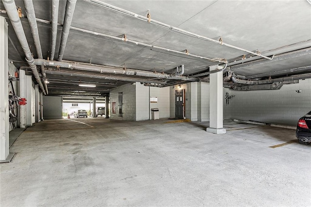 parking deck featuring concrete block wall