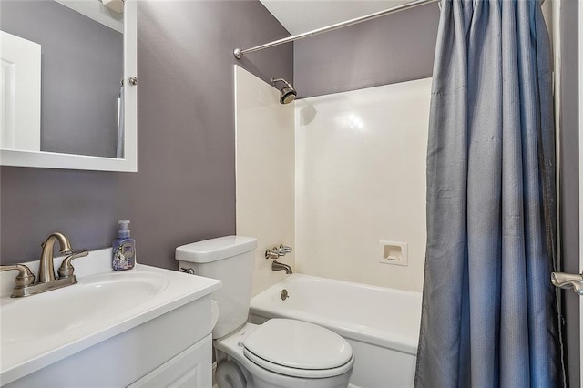 full bathroom with shower / tub combo with curtain, vanity, and toilet