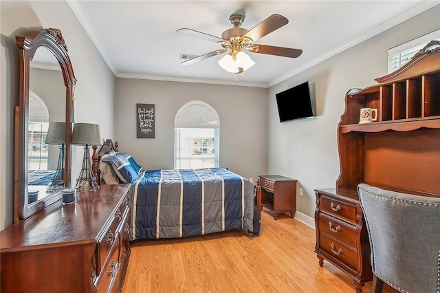 bedroom with multiple windows, ceiling fan, ornamental molding, and light wood-type flooring