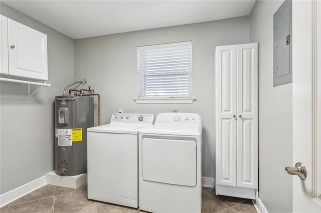 laundry room featuring cabinets, electric water heater, electric panel, washer and dryer, and dark tile patterned floors