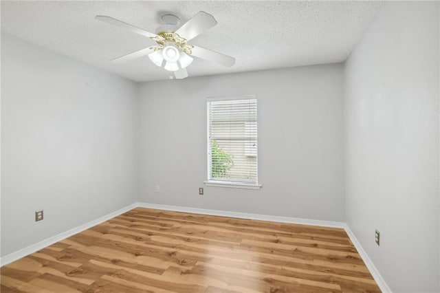 empty room featuring a textured ceiling, ceiling fan, and hardwood / wood-style flooring