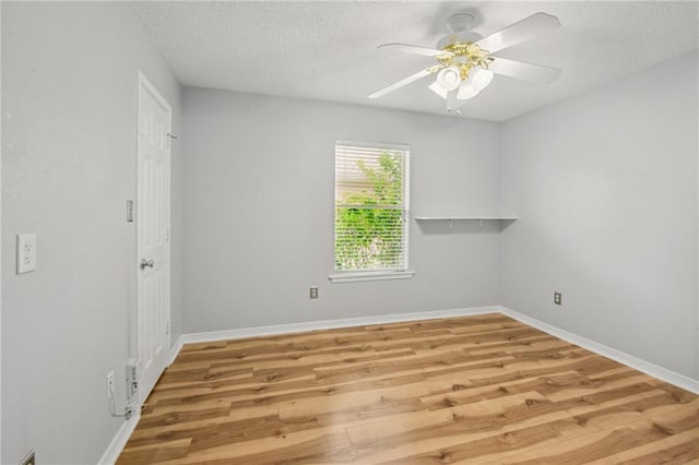 unfurnished room featuring ceiling fan and light hardwood / wood-style floors