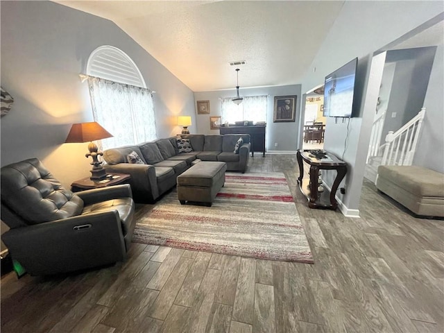 living room with lofted ceiling and hardwood / wood-style flooring