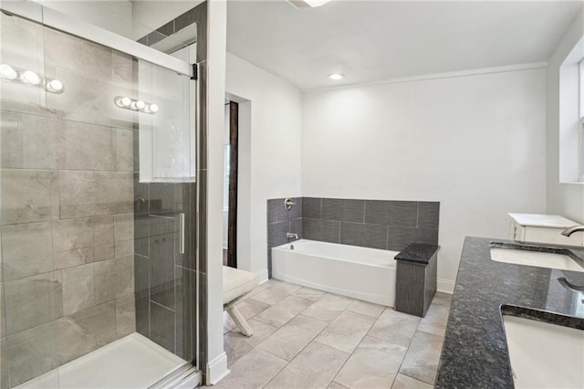 bathroom with independent shower and bath and vanity