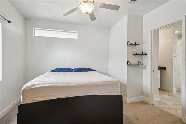 bedroom featuring light colored carpet and ceiling fan