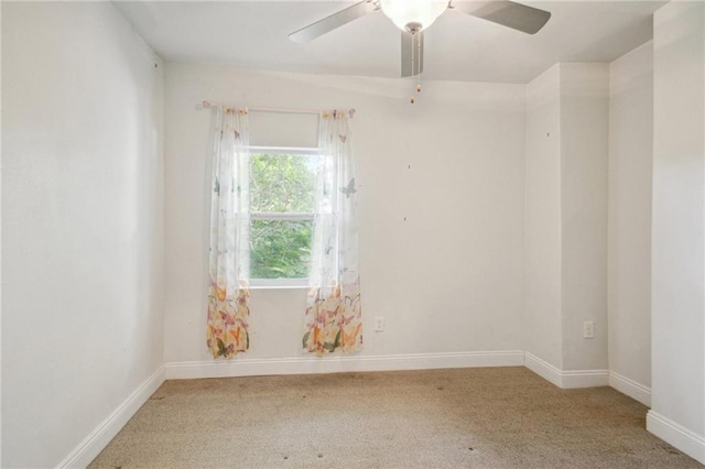 empty room with carpet flooring and ceiling fan