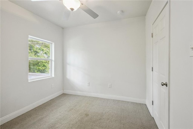 unfurnished bedroom with ceiling fan and carpet flooring