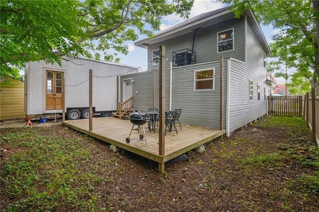 back of property with a wooden deck