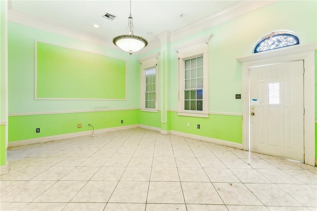 entryway featuring a wealth of natural light and ornamental molding