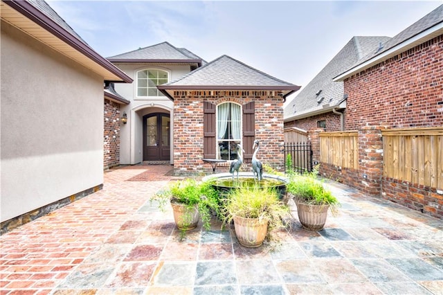 entrance to property with a patio