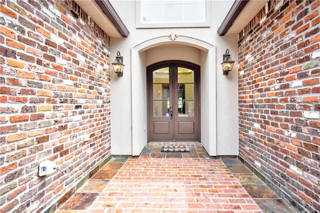 view of exterior entry featuring french doors