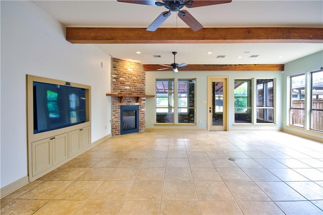 unfurnished living room featuring light tile patterned floors, beam ceiling, ceiling fan, and a brick fireplace