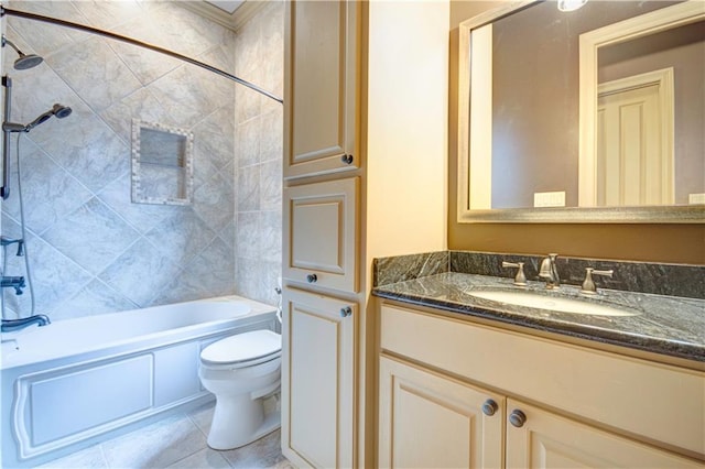 full bathroom with vanity, tile patterned floors, tiled shower / bath, and toilet