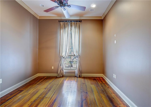 spare room with crown molding, dark hardwood / wood-style flooring, and ceiling fan