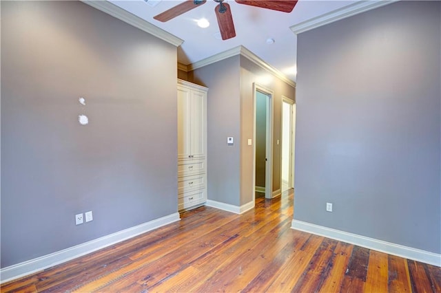 unfurnished bedroom featuring ceiling fan, crown molding, and dark hardwood / wood-style floors