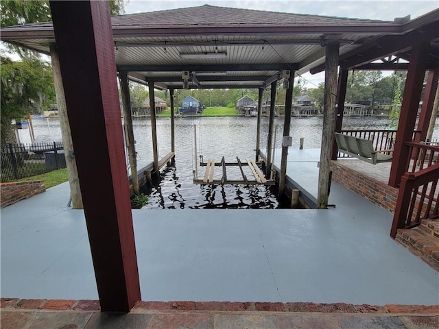 dock area featuring a water view