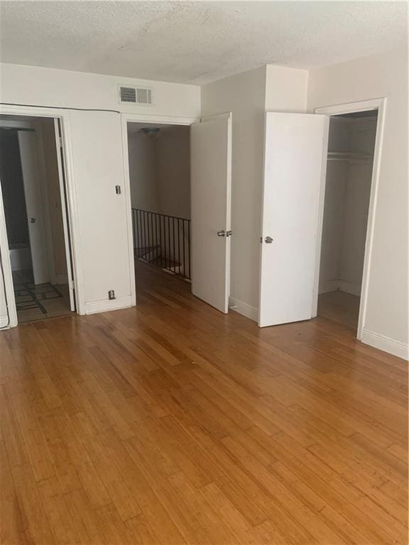 unfurnished bedroom with light hardwood / wood-style flooring