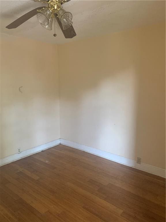 unfurnished room featuring hardwood / wood-style flooring and ceiling fan