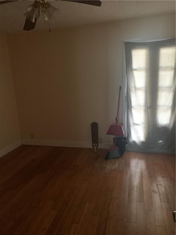 interior space with hardwood / wood-style flooring and ceiling fan