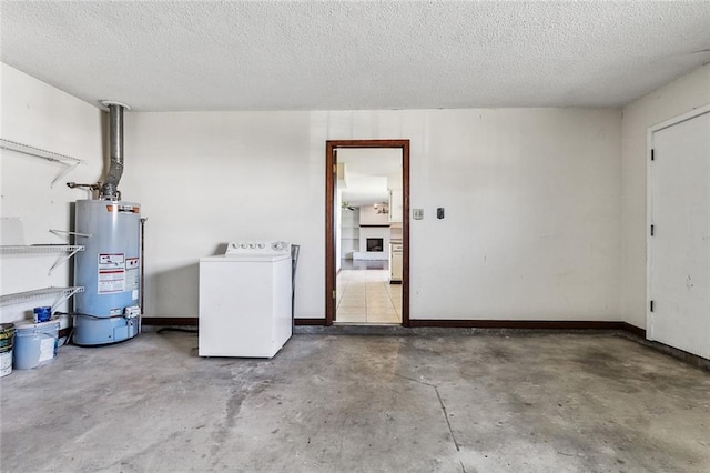 interior space with washer / clothes dryer, water heater, and a textured ceiling