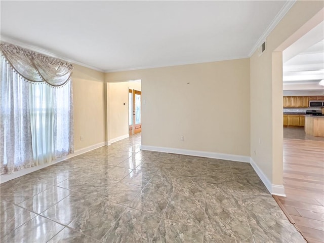 tiled empty room with crown molding