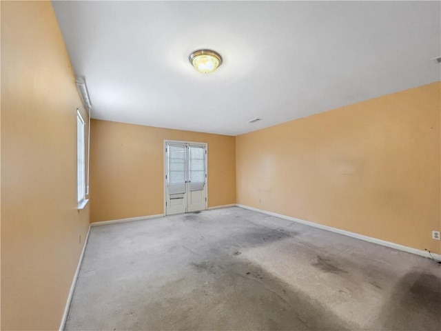 unfurnished room featuring carpet floors