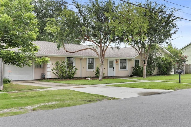 ranch-style home featuring a front lawn and a garage