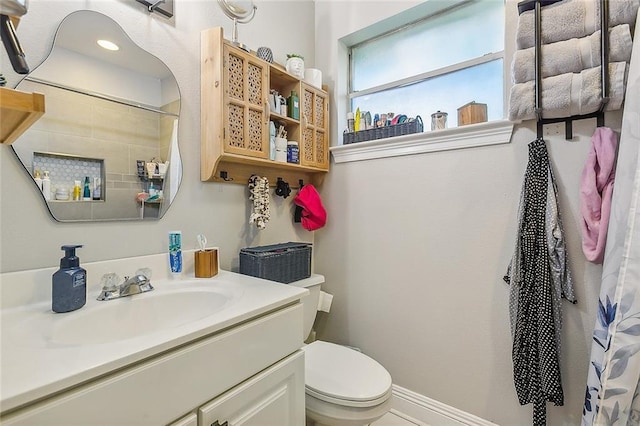 bathroom with vanity and toilet