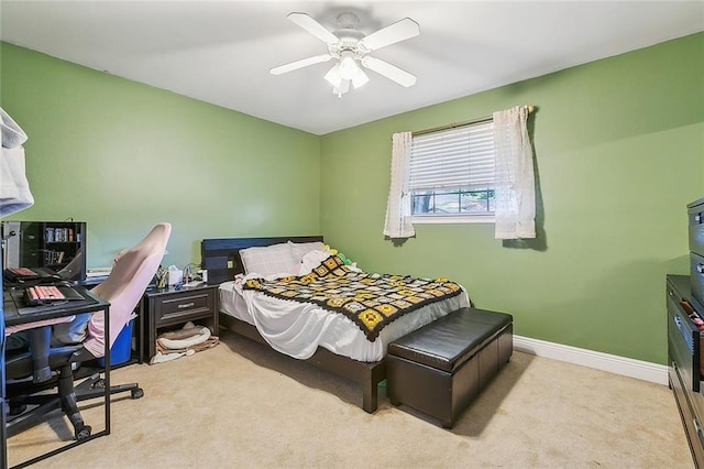 bedroom featuring light carpet and ceiling fan