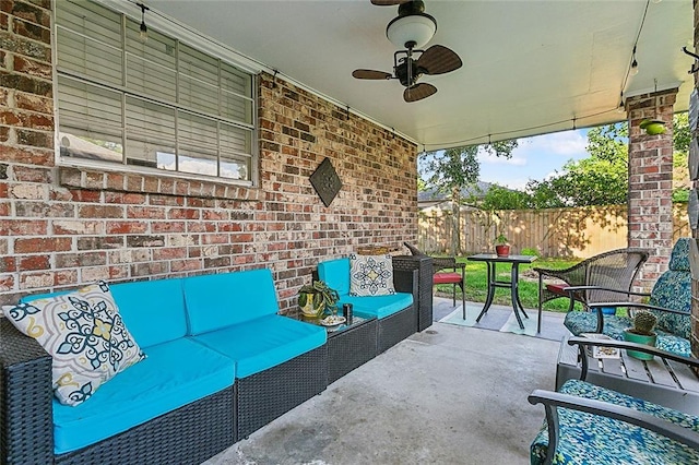 view of patio featuring an outdoor hangout area and ceiling fan