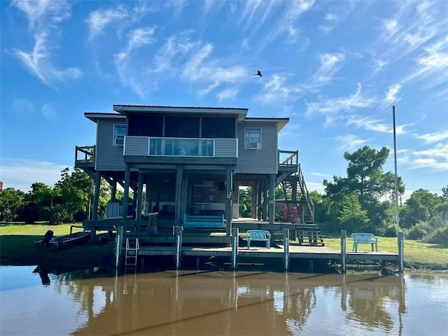 back of house with a water view