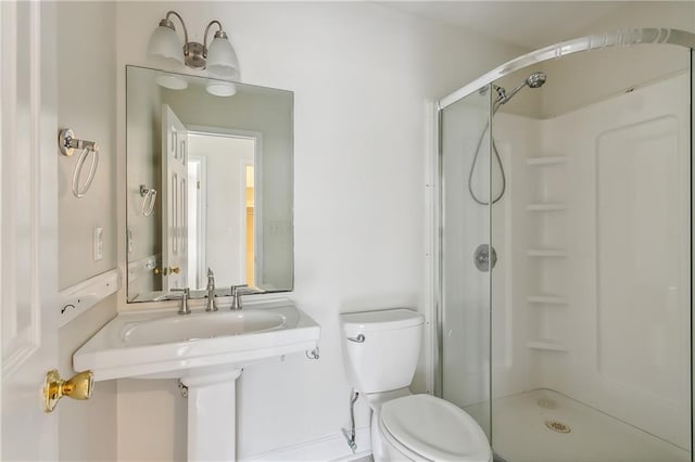 bathroom with a shower and toilet