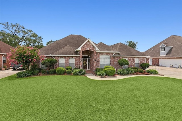 view of front of house featuring a garage and a front lawn