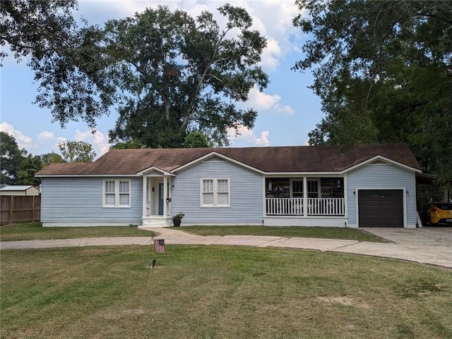 ranch-style house featuring a garage, a front lawn, and covered porch