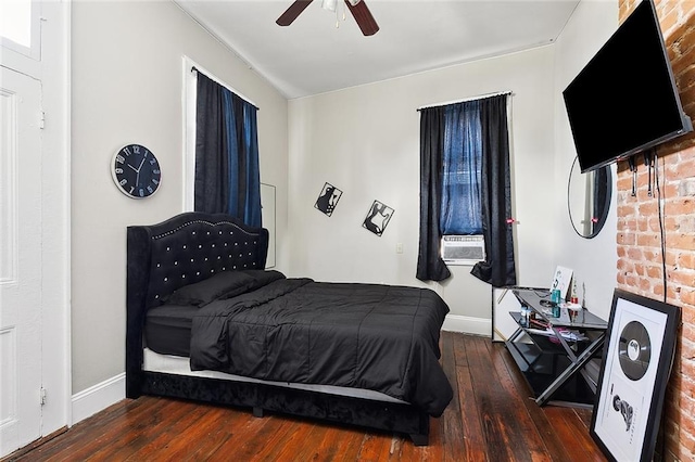 bedroom with ceiling fan and dark wood-type flooring