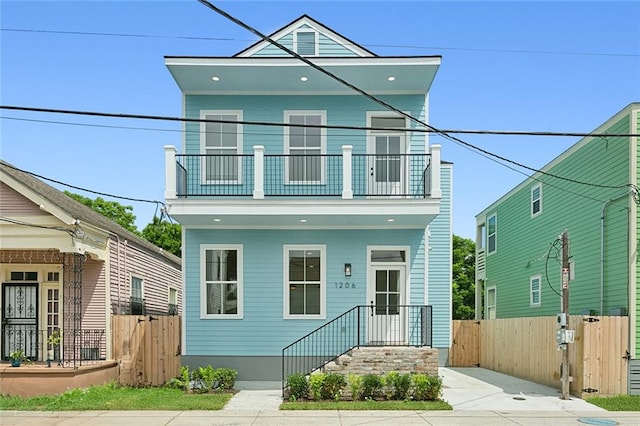 view of front of property with a balcony