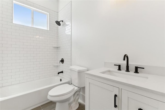 full bathroom with tile patterned flooring, toilet, tiled shower / bath combo, and vanity