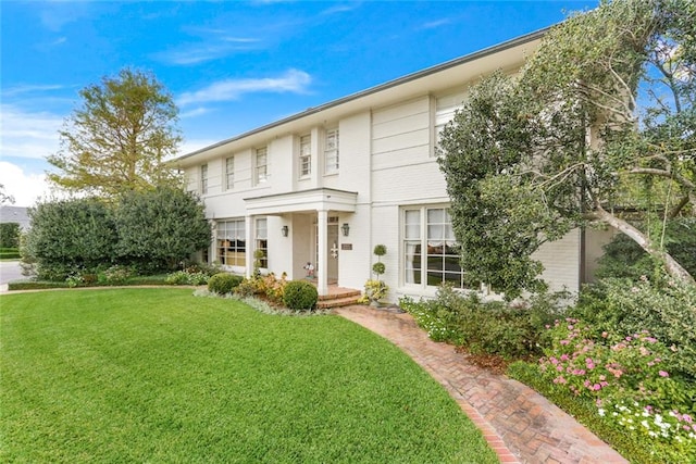 view of front of property with a front lawn