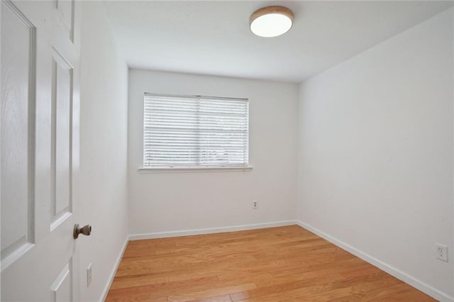 unfurnished room featuring hardwood / wood-style flooring