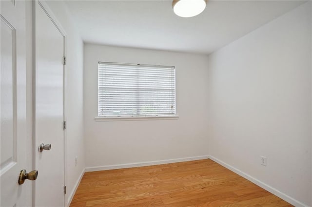 unfurnished room featuring hardwood / wood-style flooring