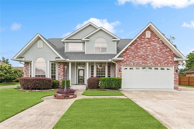 view of front of property with a garage and a front lawn